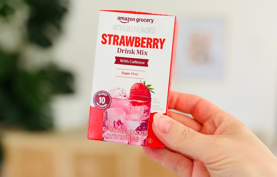 hand holding strawberry drink mix box