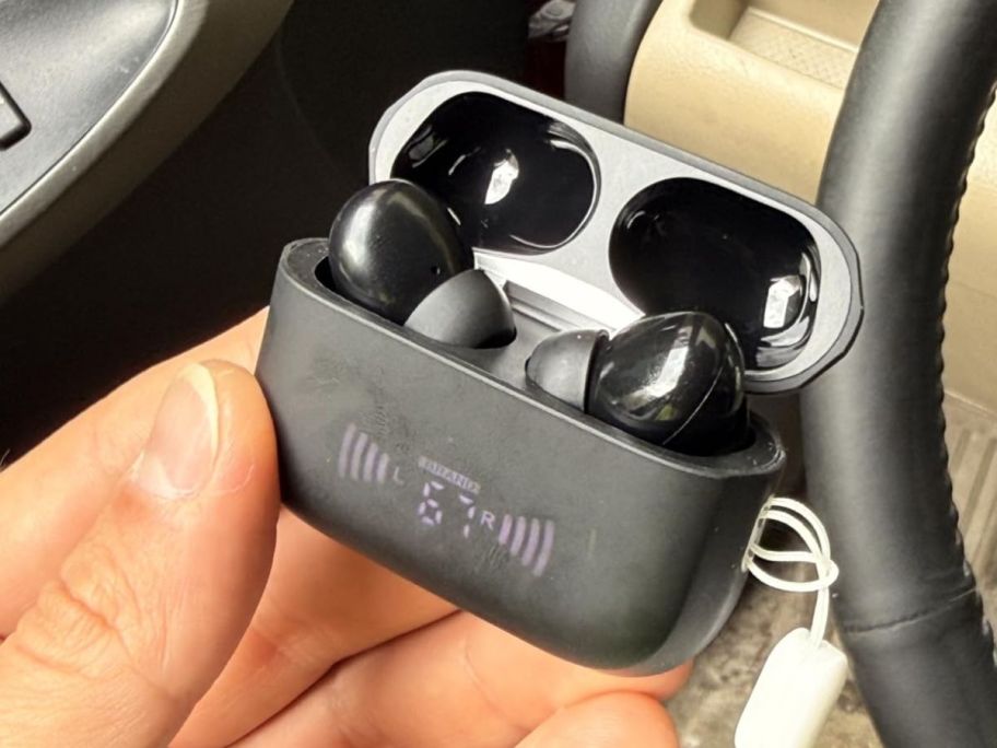 hand holding BLXSounds Wireless Bluetooth Earbuds