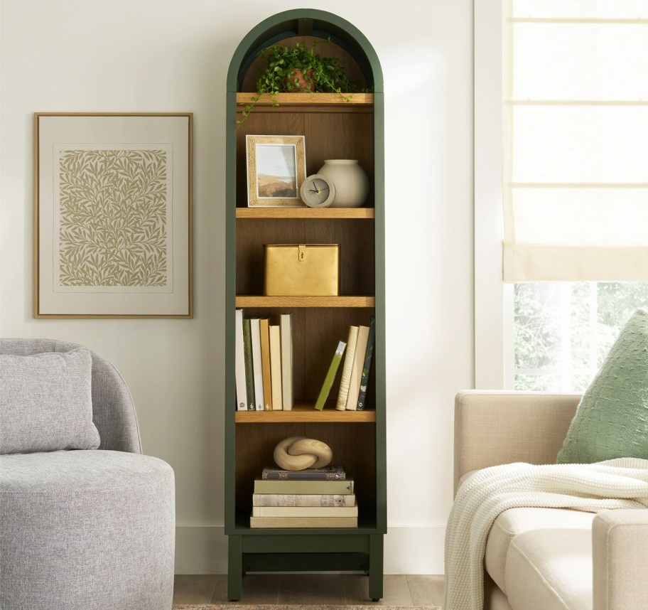 narrow green arched cabinet