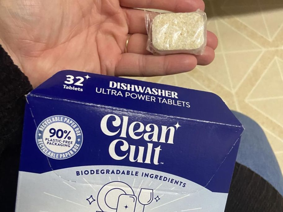 Someone holding a Clean Cult Dishwasher Tablet