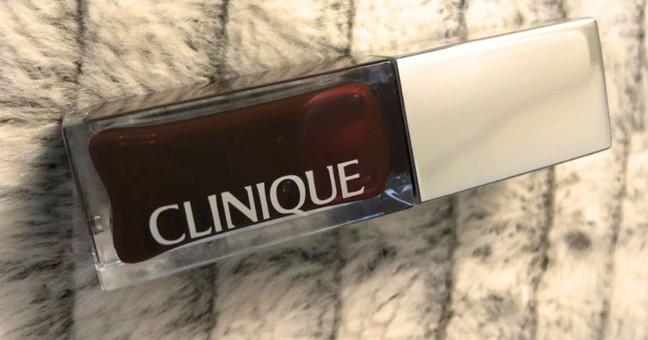 A tube of Clinique Black Honey Pop Lip + Cheek Oil