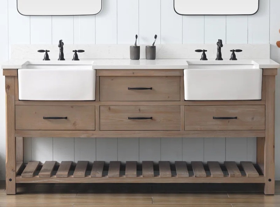 wood double vanity in bathroom with two white sinks
