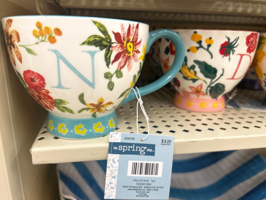 monogrammed mugs on store shelf
