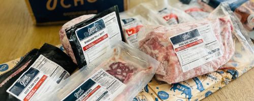 Good chop items box with items on the outside on top of the table