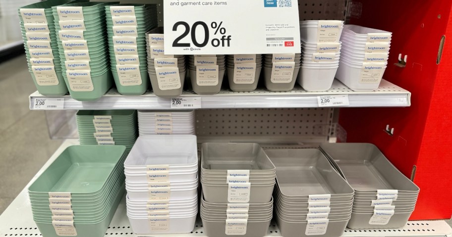 various storage baskets on a Target end cap with a 20% off sign