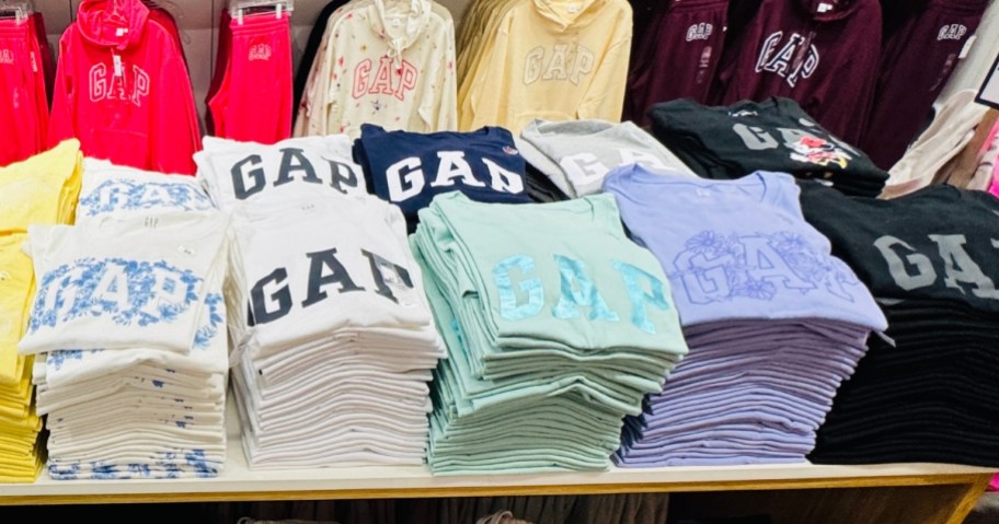 GAP tshirts on a table in a GAP Factory store