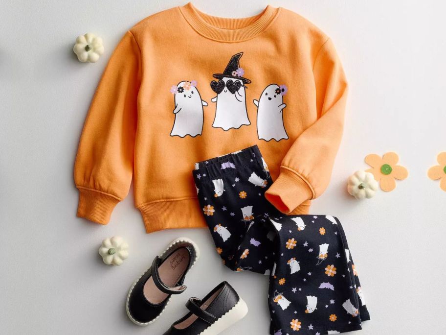 A Jumping Beans toddler girl halloween sweatshirt and flare leg pants with a pair of jumping beans may janes