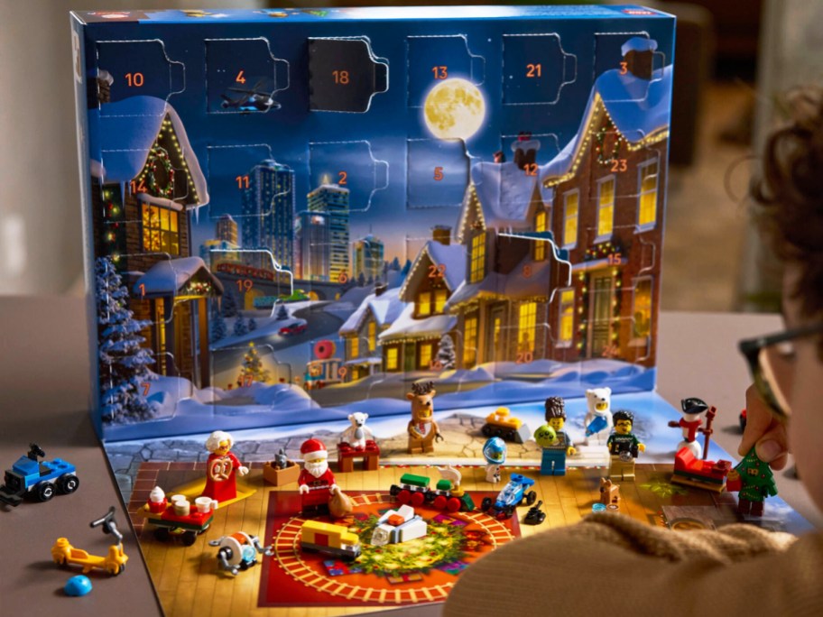 boy playing with a LEGO City advent calendar