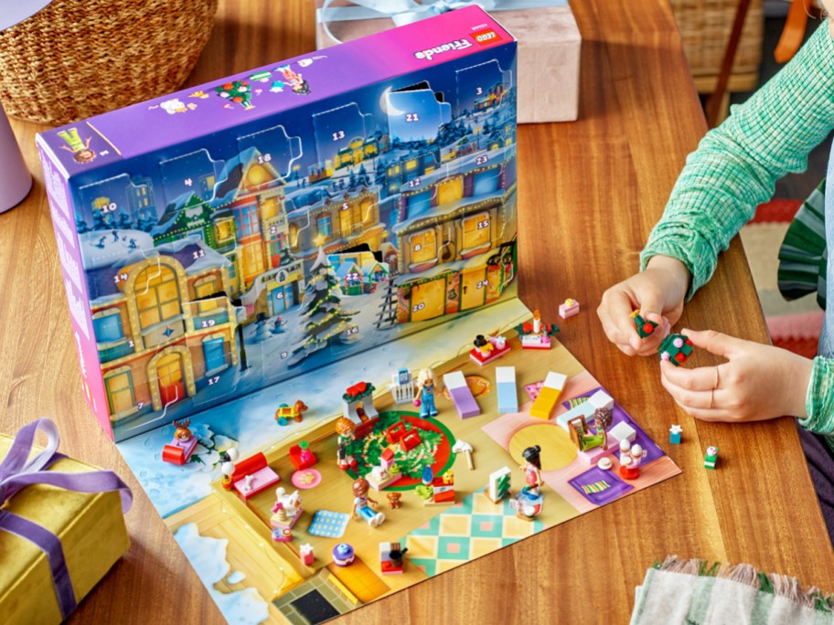 girl playing with a LEGO Friends advent calendar