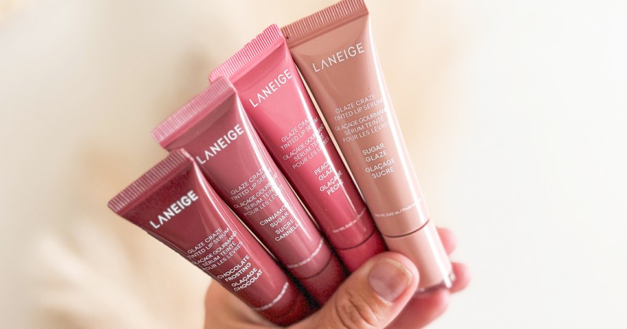 hand holding 4 tubes of Laneige Glaze Craze Tinted Lip Serums