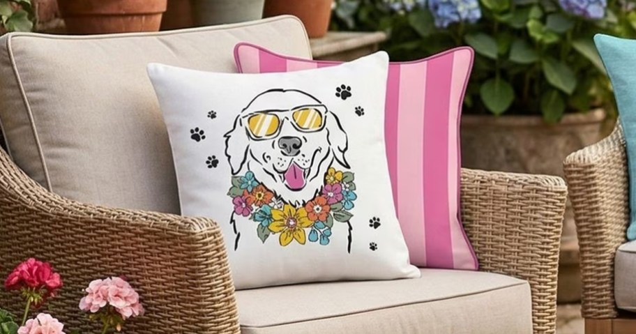 dog print throw pillows on patio chair