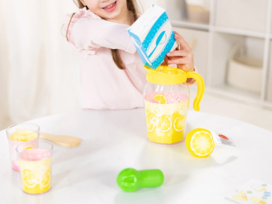 child playing with a lemonade themed playset