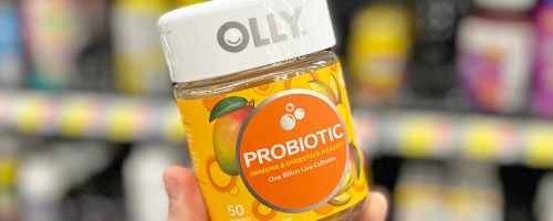 hand holding a bottle of OLLY Probiotic Gummies in store
