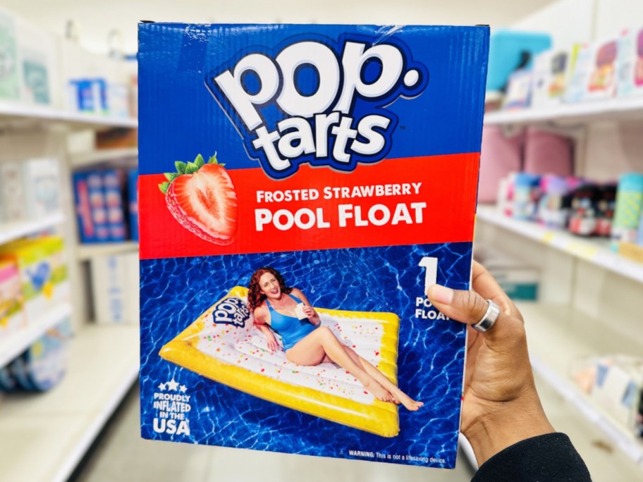 hand holding a Pop-Tarts Pool Float box in store