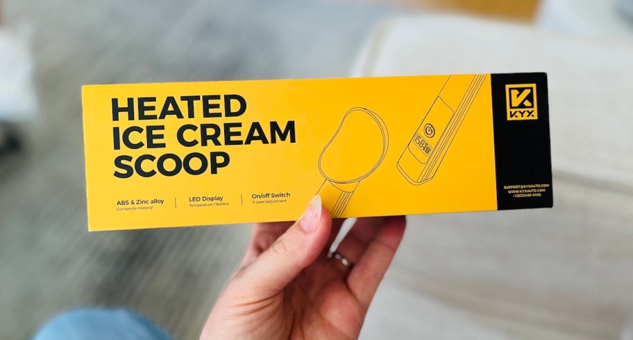 hand holding yellow box with rechargeable ice cream scoop 