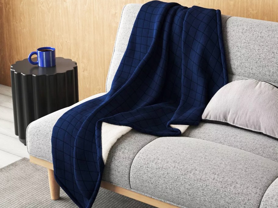 navy blue throw on a couch