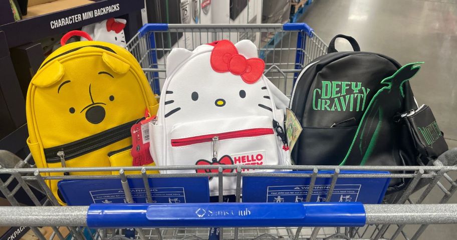 Mini Backpacks Winnie the Pooh, Hello Kitty, and Wicketed themed in a cart
