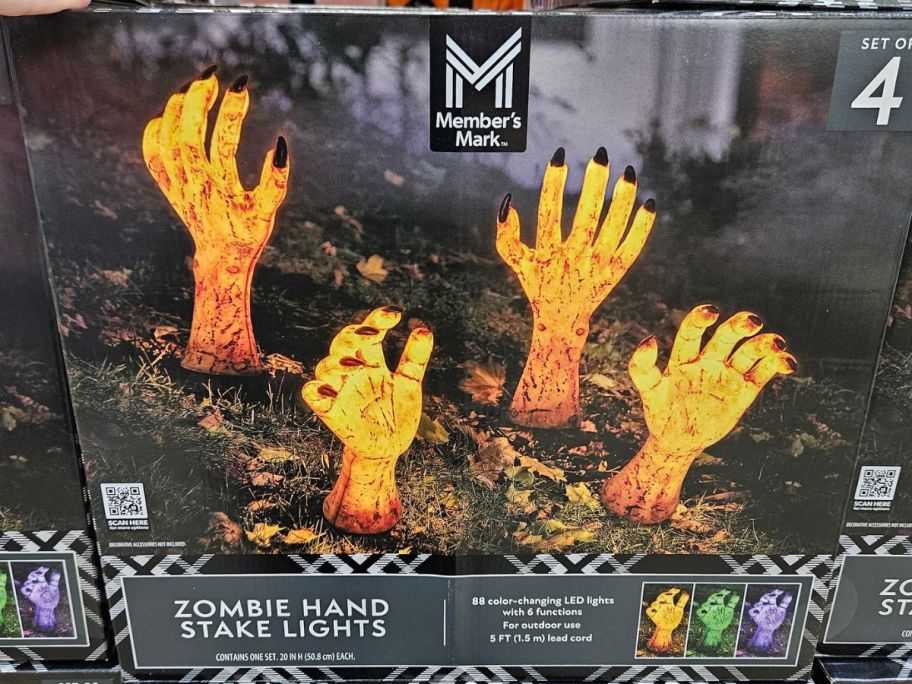 A box with Member's Mark Zombie Hand Stake Lights 