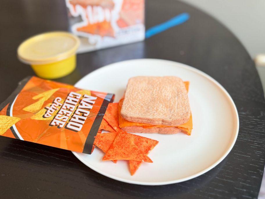Plate with a Slime Life Grilled Cheese and Chips