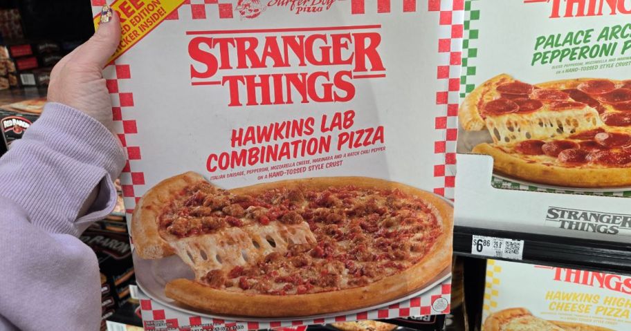 A person holding Stranger Things Pizza Hawkins Lab Combination