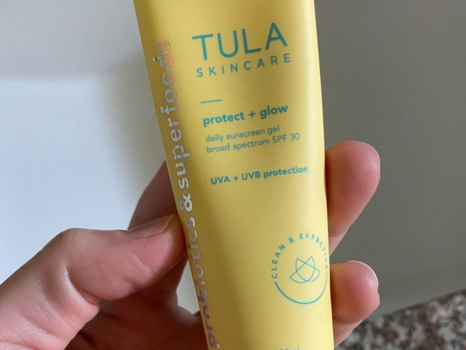 Hand holding tula spf 