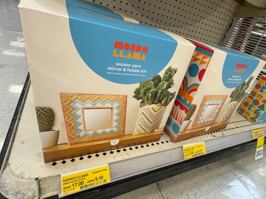 A Mondo LLama Woven Yarn Mirror & Holder Craft Kit on the shelf at Target with a yellow clearance tag under it
