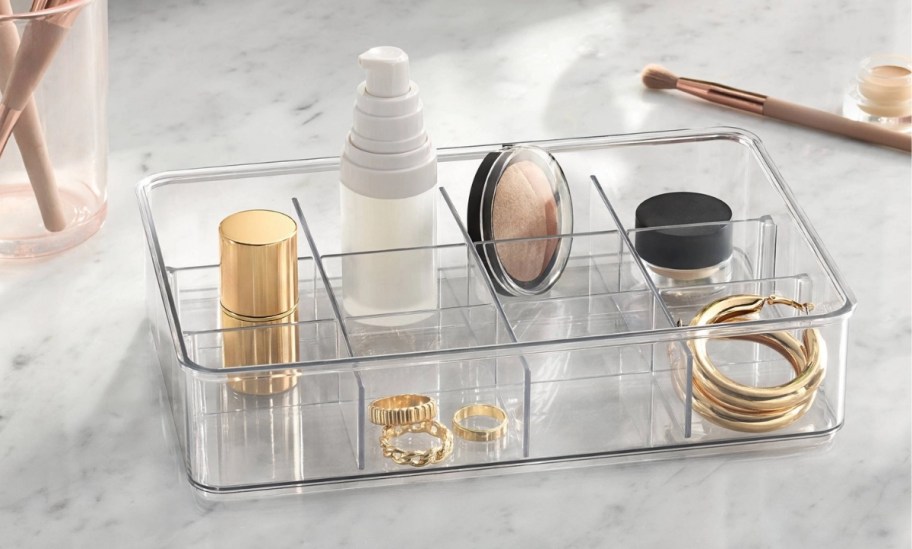 clear tray organizer on a bathroom countertop
