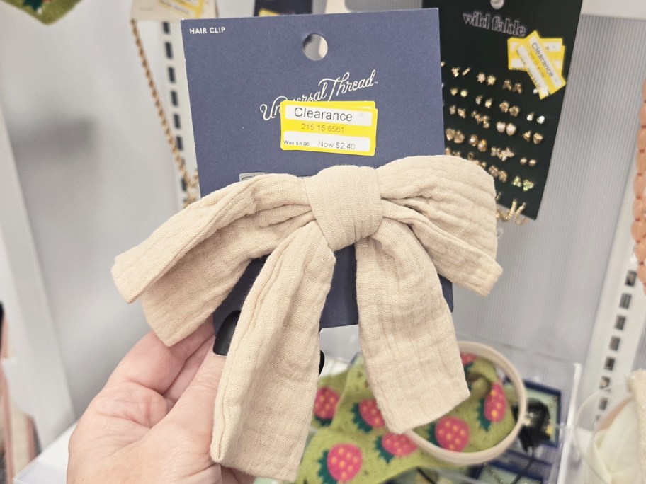 hand holding a hair bow clip in store
