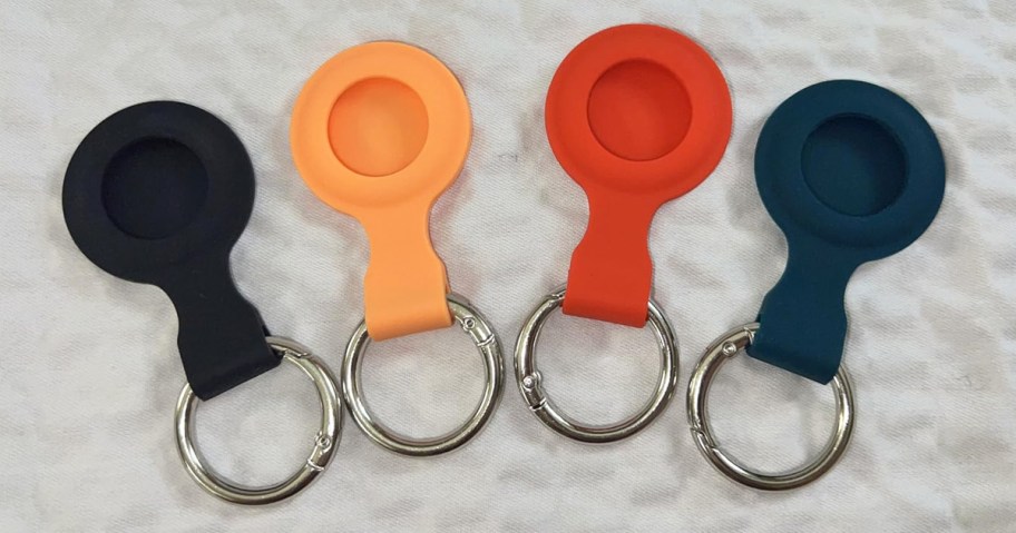 black, orange, red, and blue airtag holders