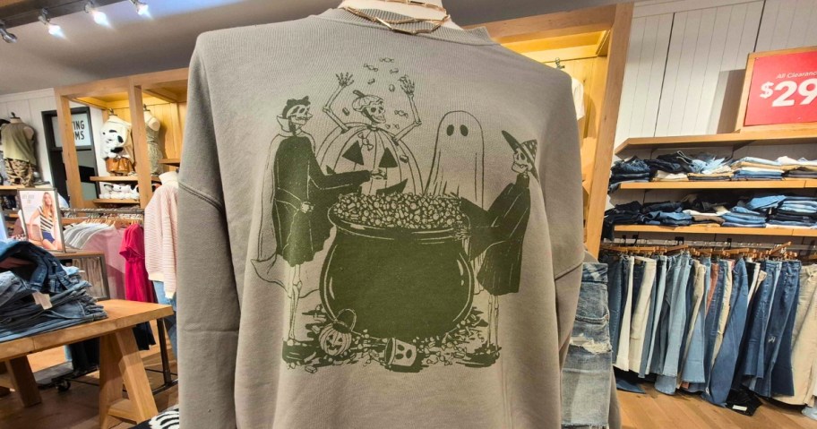 women's Halloween sweatshirt on a mannequin in a store