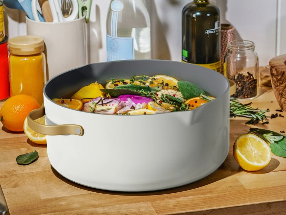 white stock pot with chicken and veggies inside