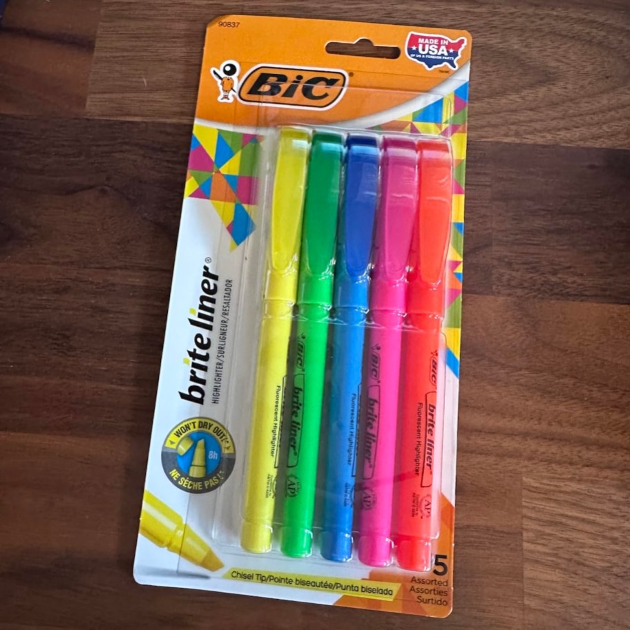 pack of bic highlighters on wood table
