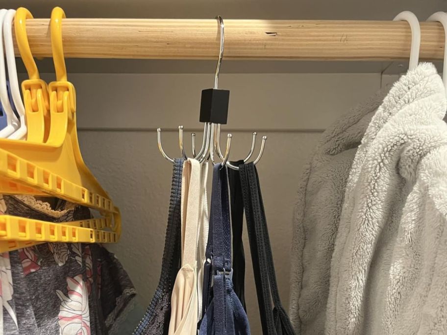 hanger with bras and tank tops hanging in closet