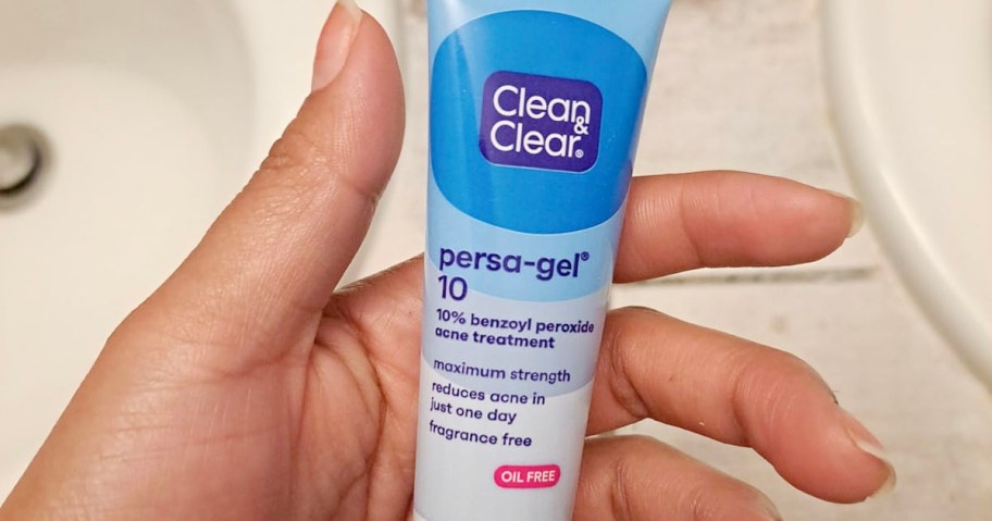 hand holding clean and clear persa gel treatment 