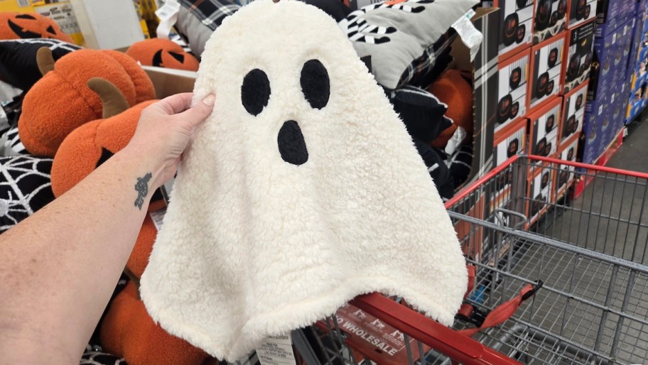 hand holding sherpa ghost pillow