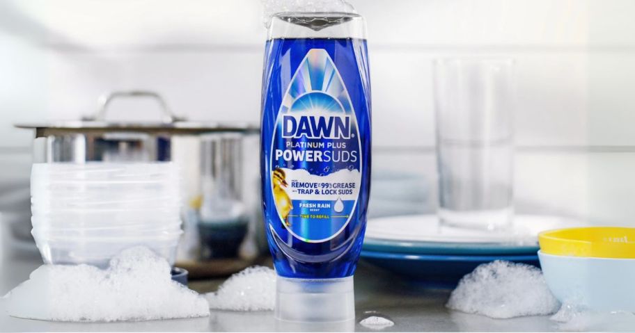 bottle of Dawn Platinum Plus PowerSuds near dishes