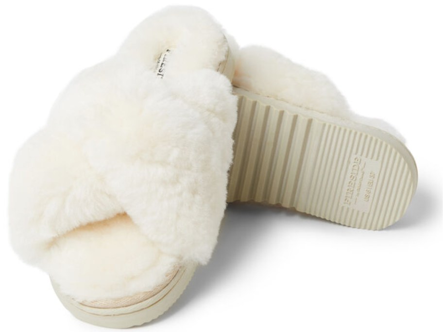 a pair of women's white fuzzy slippers
