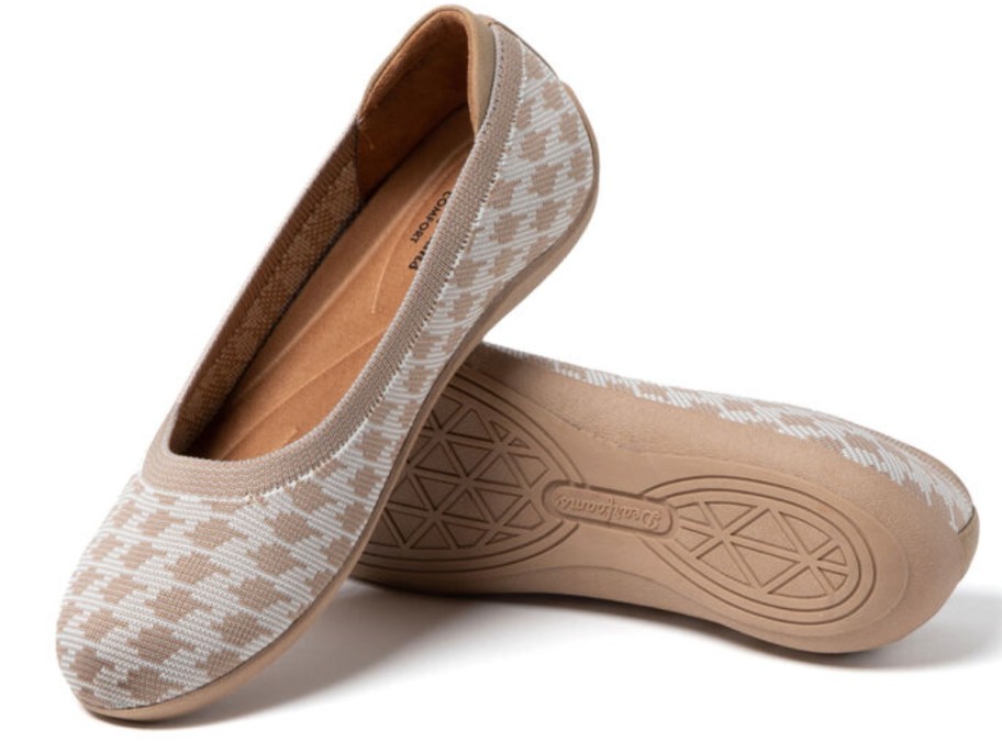 a pair of brown and cream women's ballet style flats