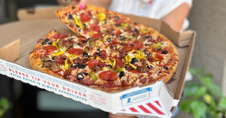 A Domino's pizza in the box.