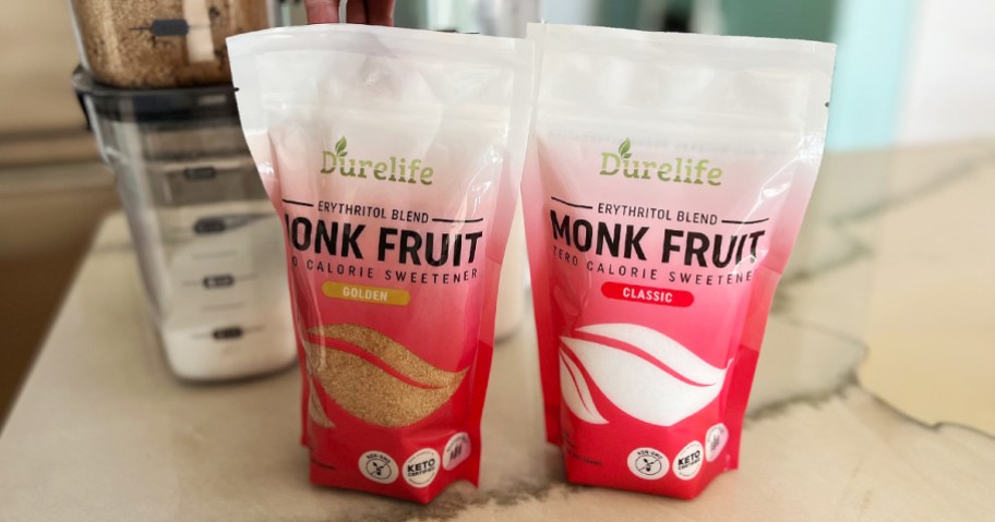 two bags of durelife monk fruit sweetener sitting on a counter