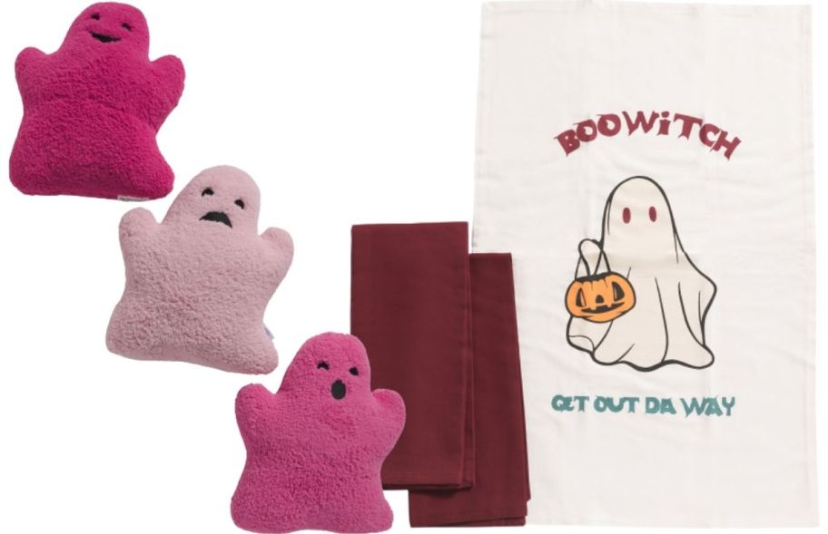 a three pack of pink ghost shaped pillows and a set of boowitch ghost kitchen towels