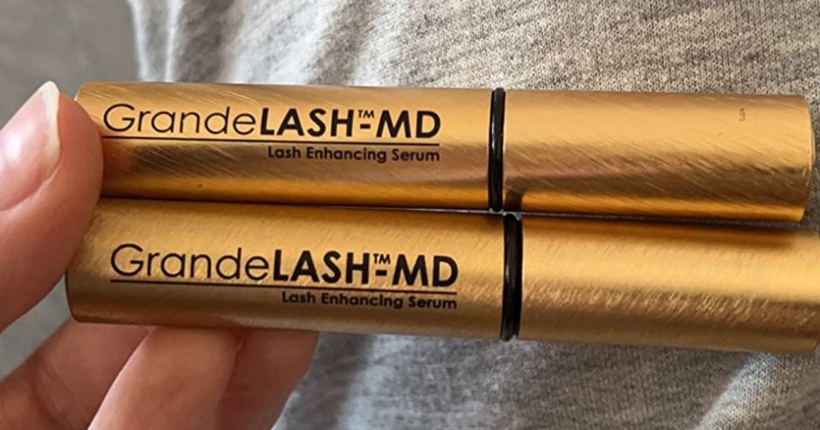 two Grande Cosmetics GrandeLASH-MD Lash Enhancing Serums in hand