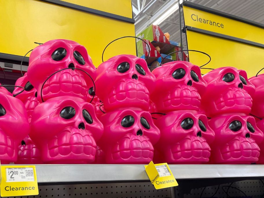 pink skull Halloween Treat Buckets on shelf in store