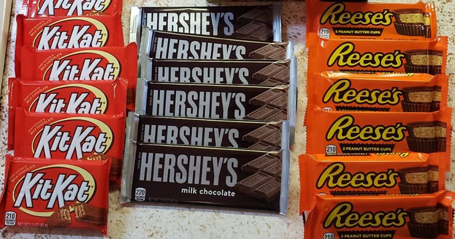 kit kat, hershey's, and reese's bars on counter