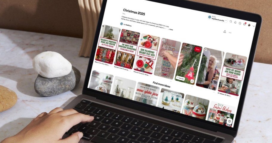 hand typing on laptop with hip2save christmas 2025 pinterest