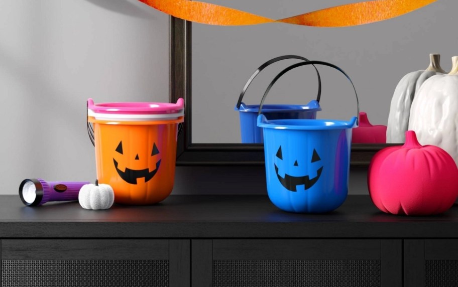 orange and blue stackable plastic jack o lantern treat pails