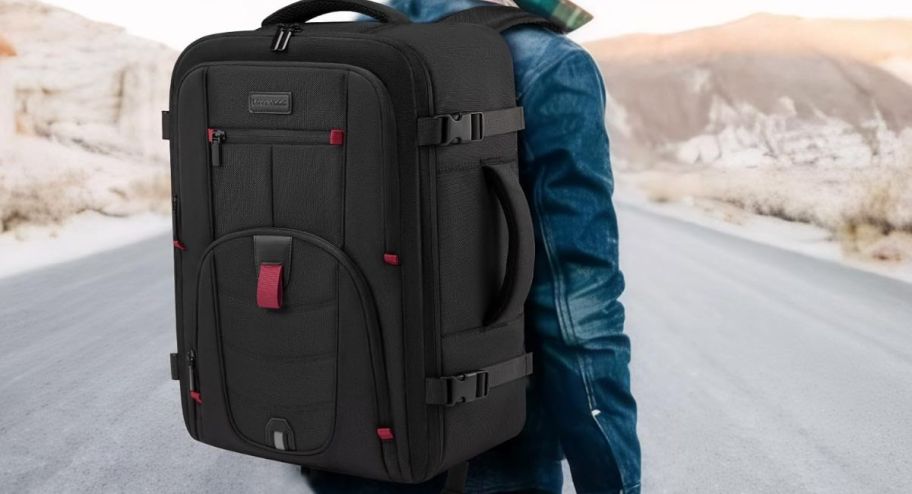 large black backpack on someones back 