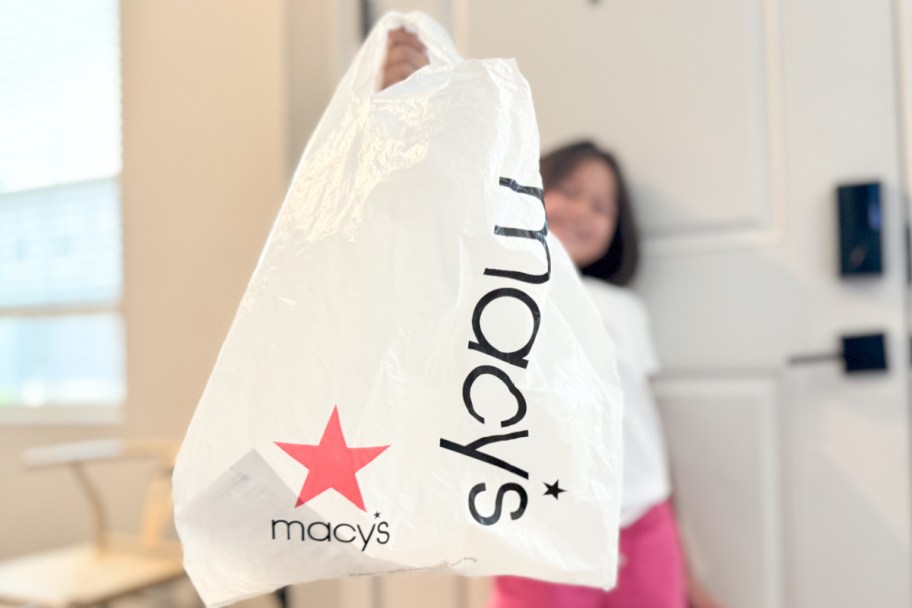 girl holding macy's bag