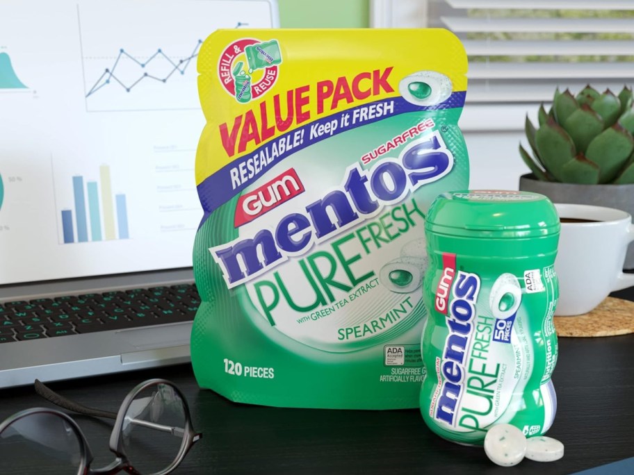 mentos gum bag and bottle on a desk