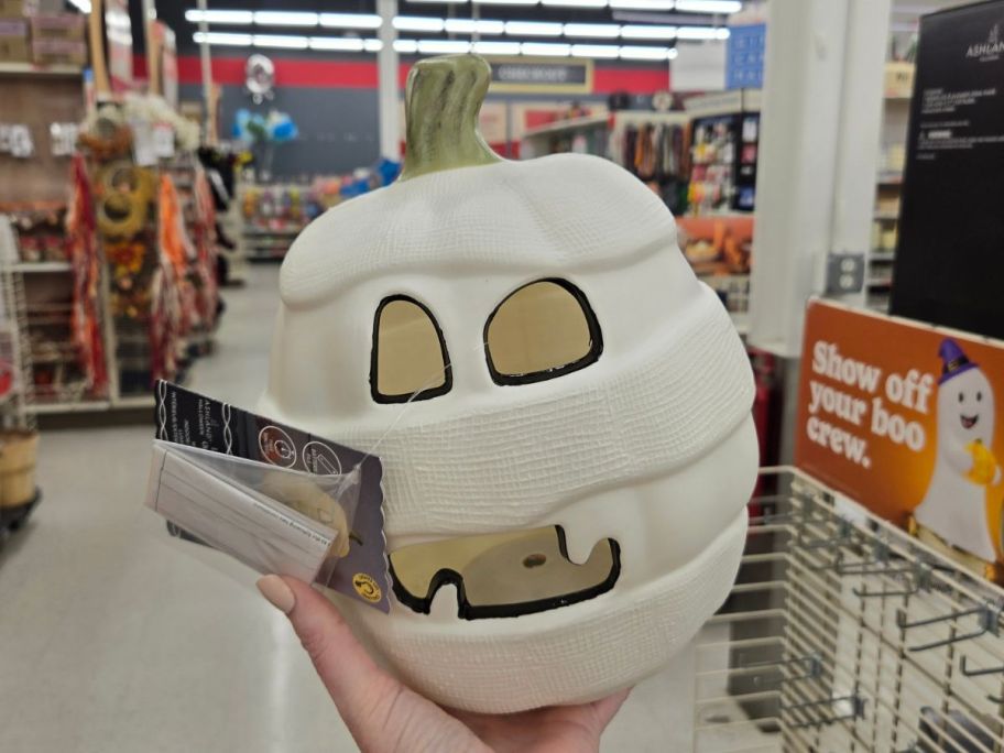 Lighted Mummy Pumpkin in hand in store